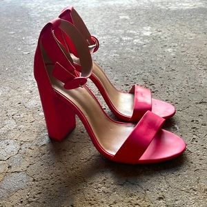 Hot pink strappy heels.
